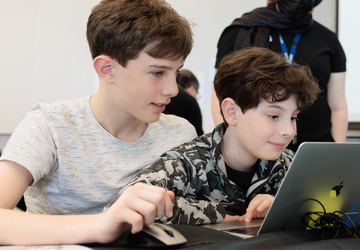 Two young boys at a laptop