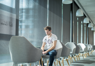 Image of man typing on laptop