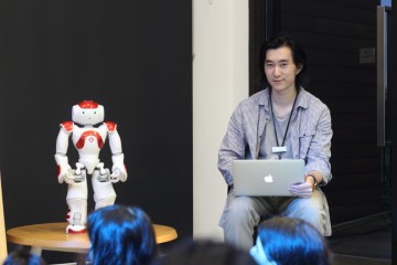 Ruby the robot with staff member