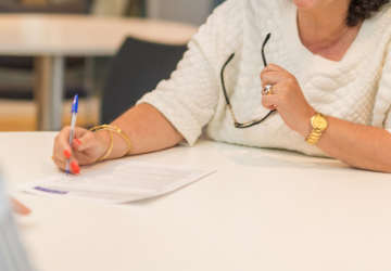 woman writing with a pen