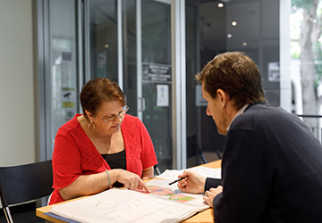 Image of woman and man looking at map