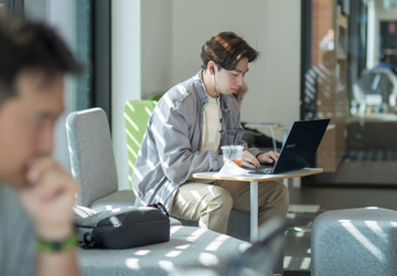 Person at laptop with headphones