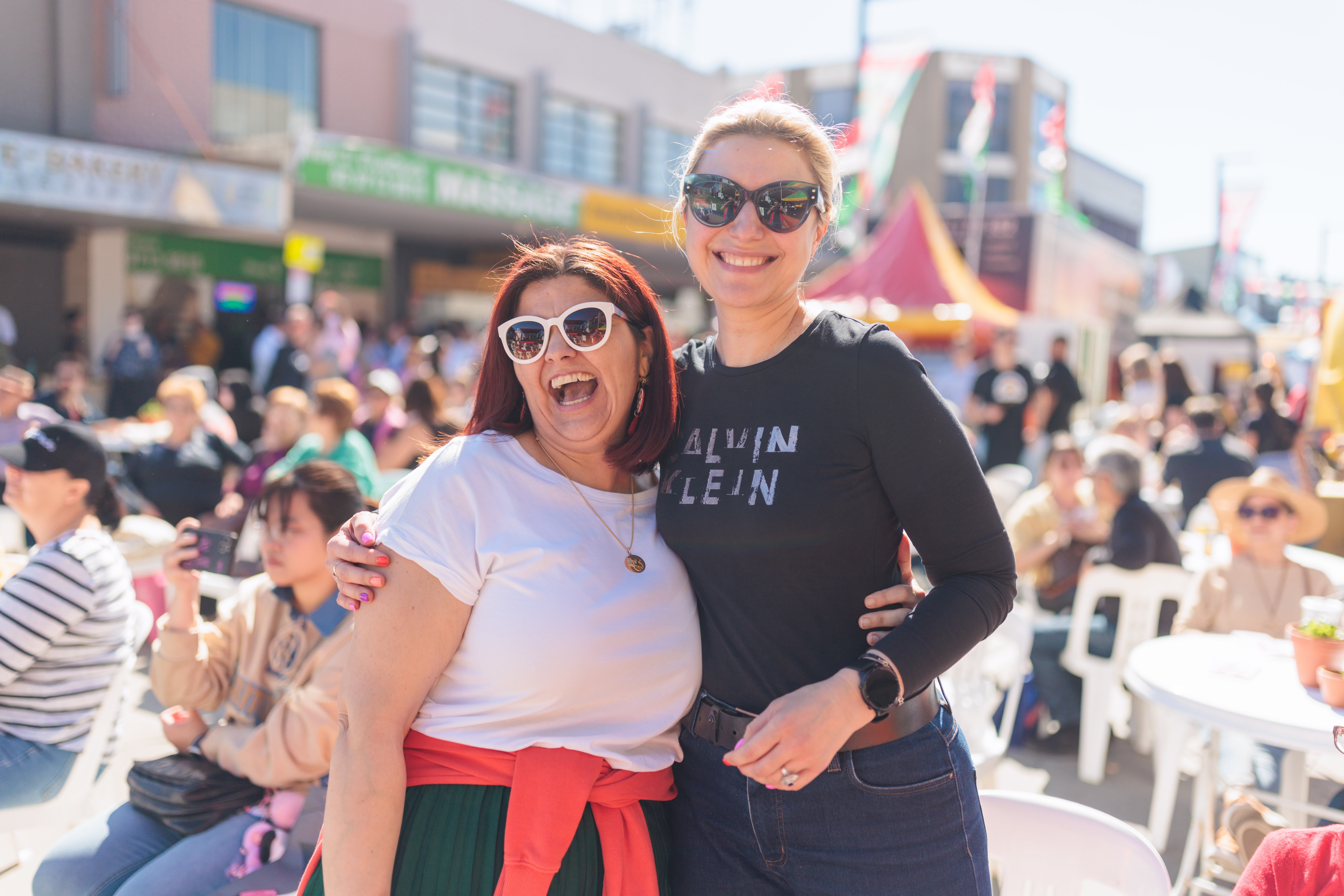 Two women smiling at the camera at Ferragosto