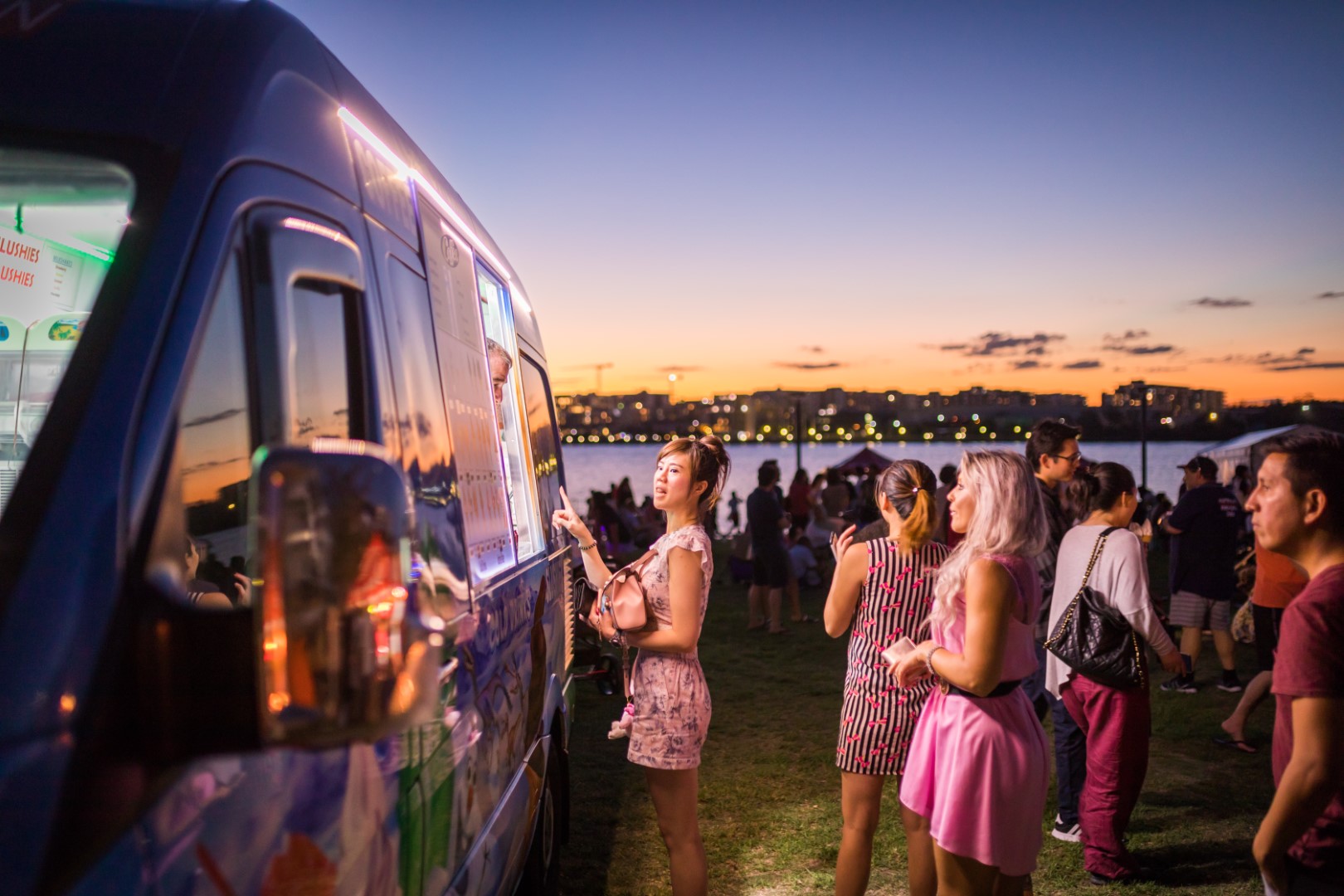 People lining in front of a food van