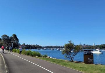 Image of the Bay Run on a sunny day, with a view of Iron Cove and Iron Cove Bridge in the distance.