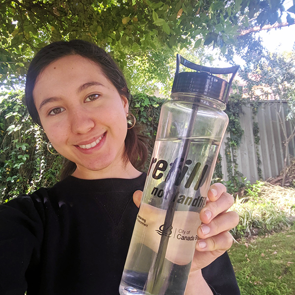 Image of young woman with reusable bottle