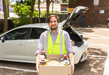 Image of staff member holding problem household items