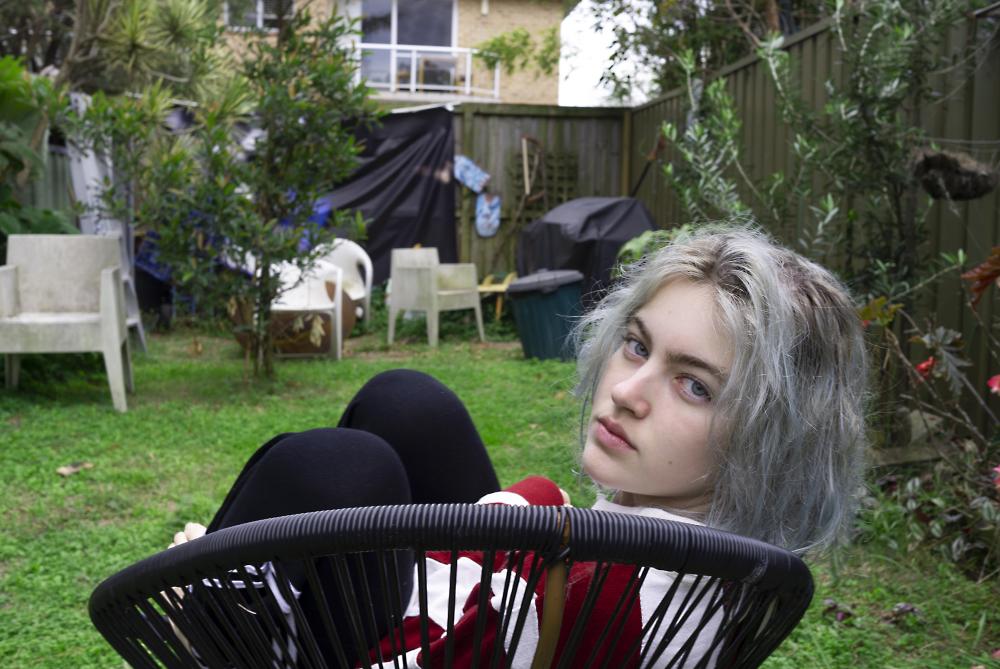 To the Sun to the Moon and Back - photo of teenage girl in backyard looking at camera