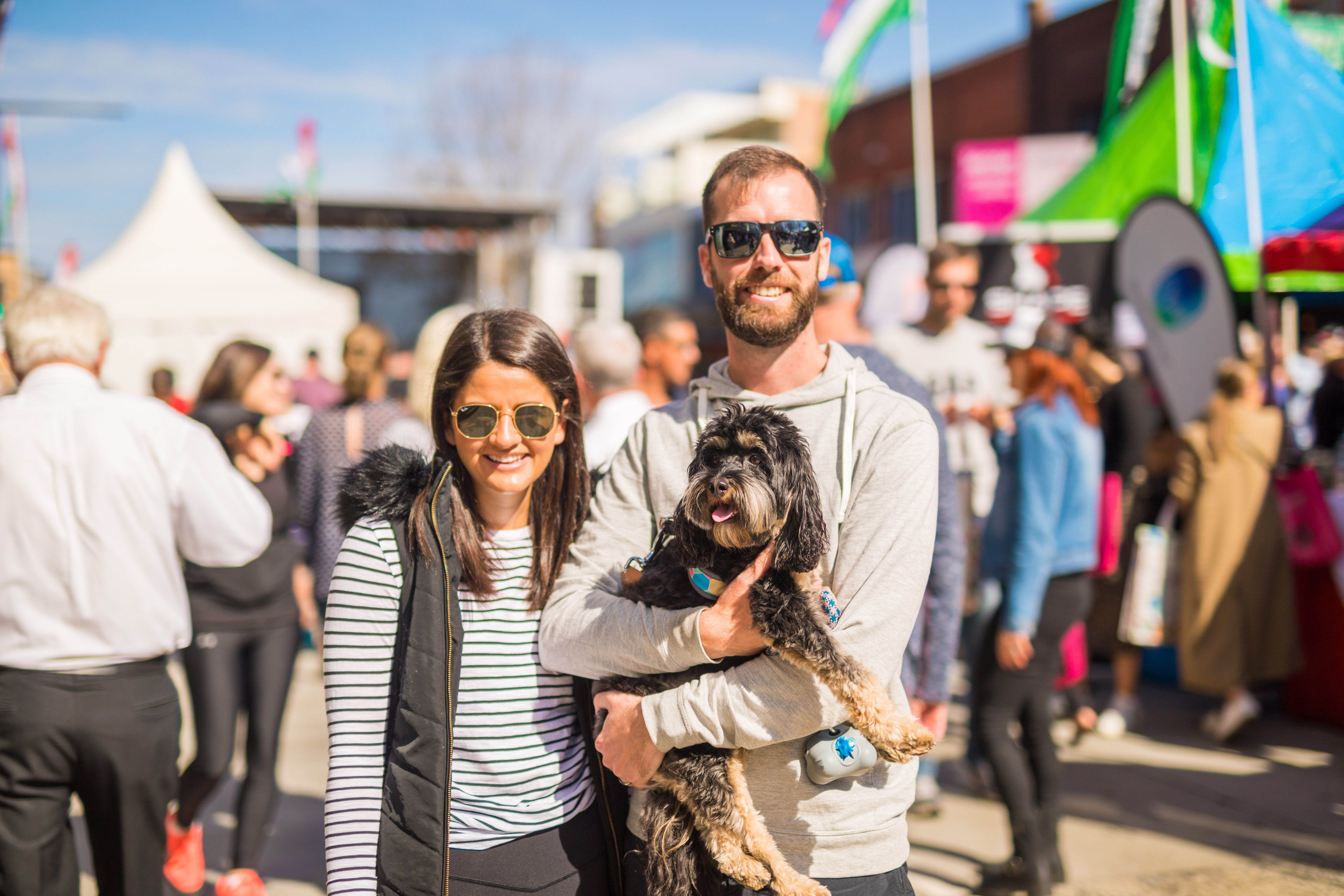 people smiling with their dog
