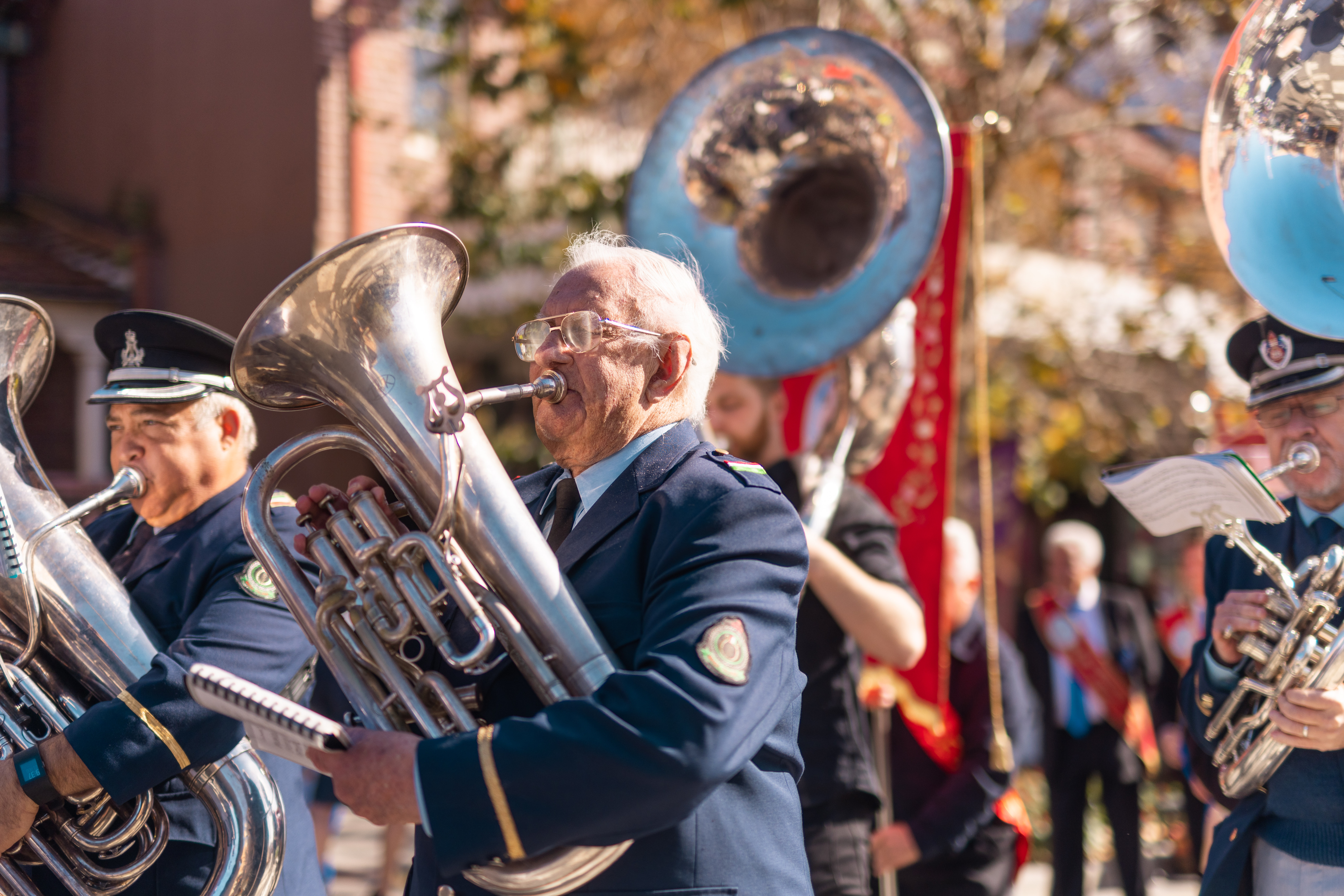men playing instruments in uniform