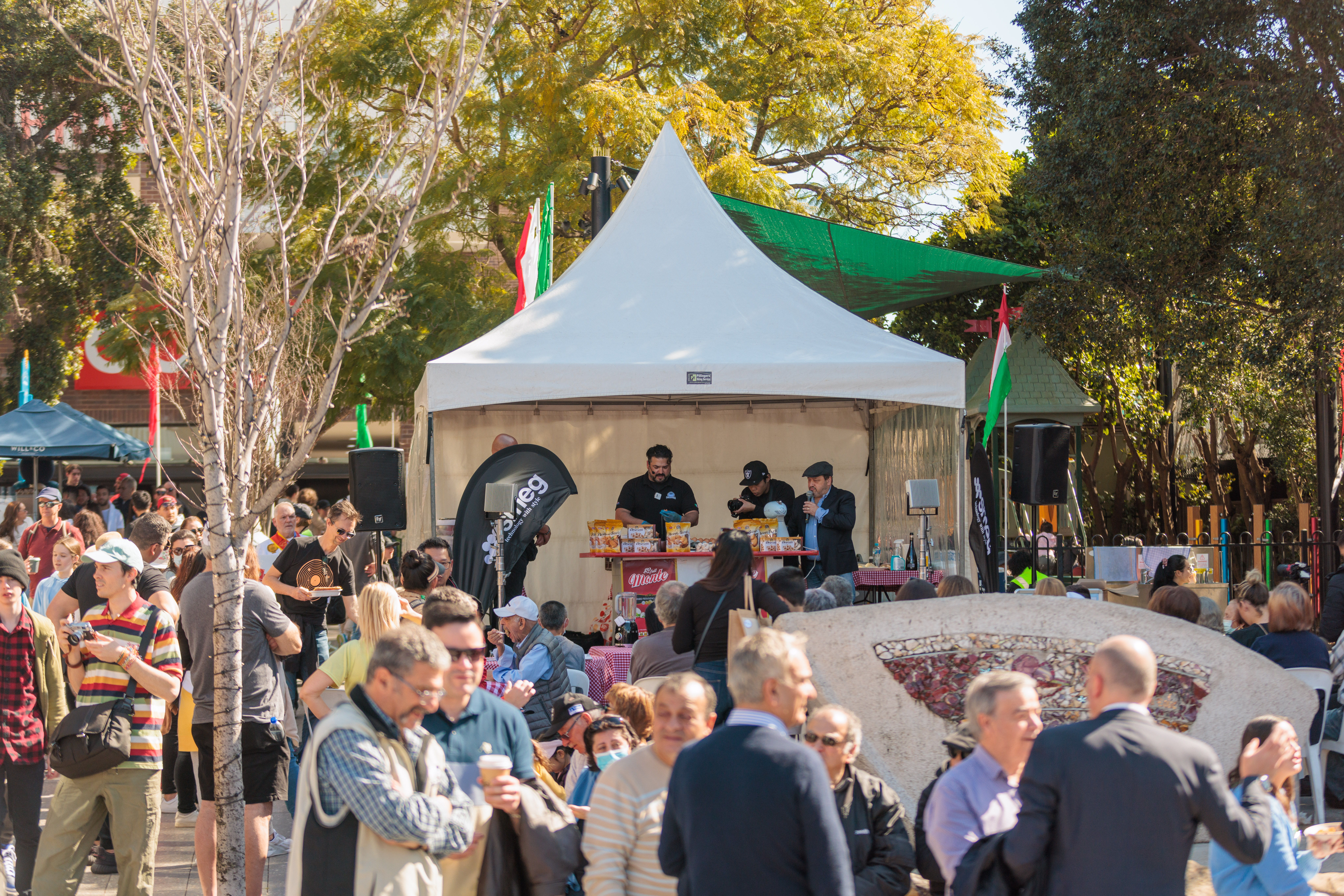 people presenting in the tent at fred kelly place