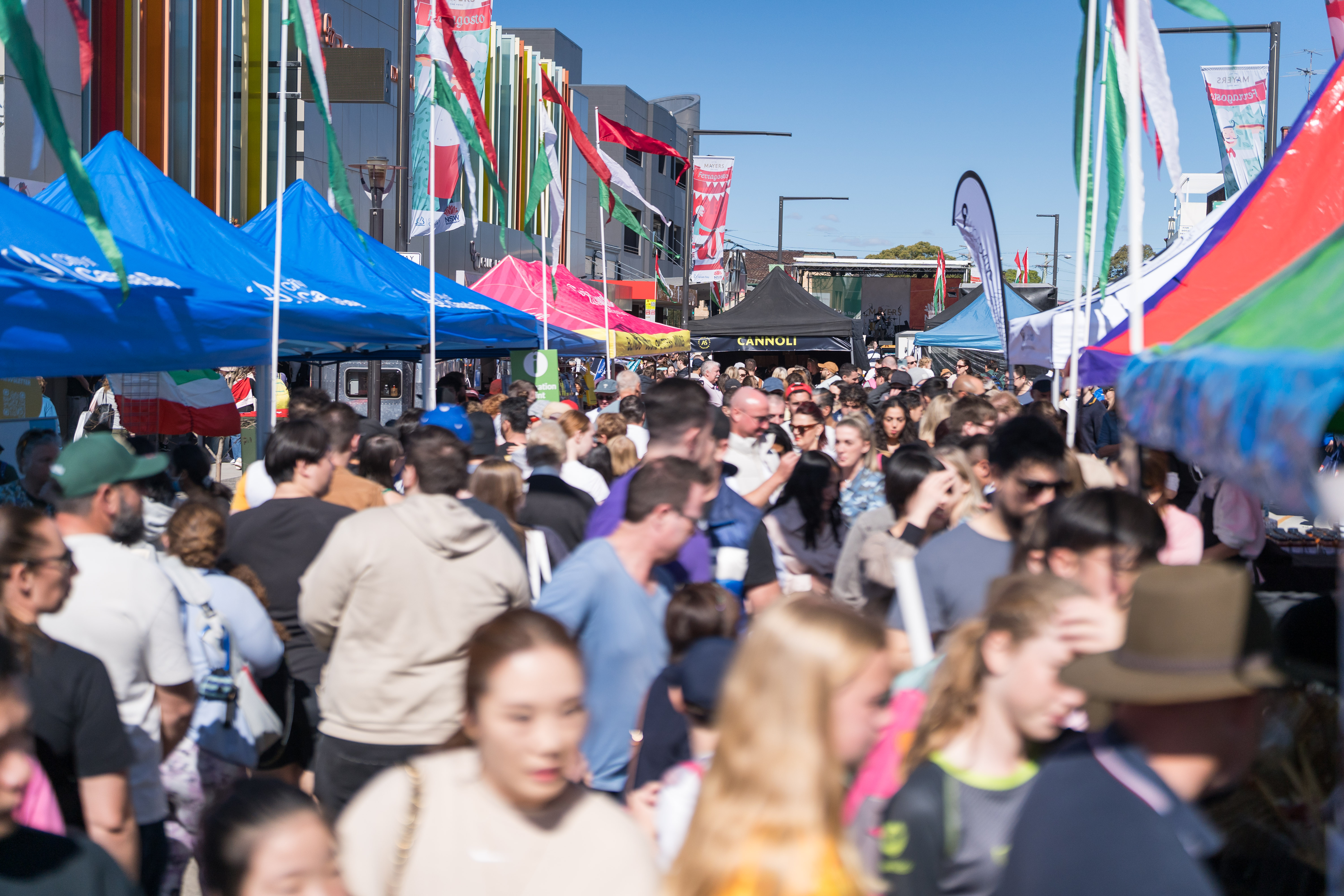 crowd walking between stalls
