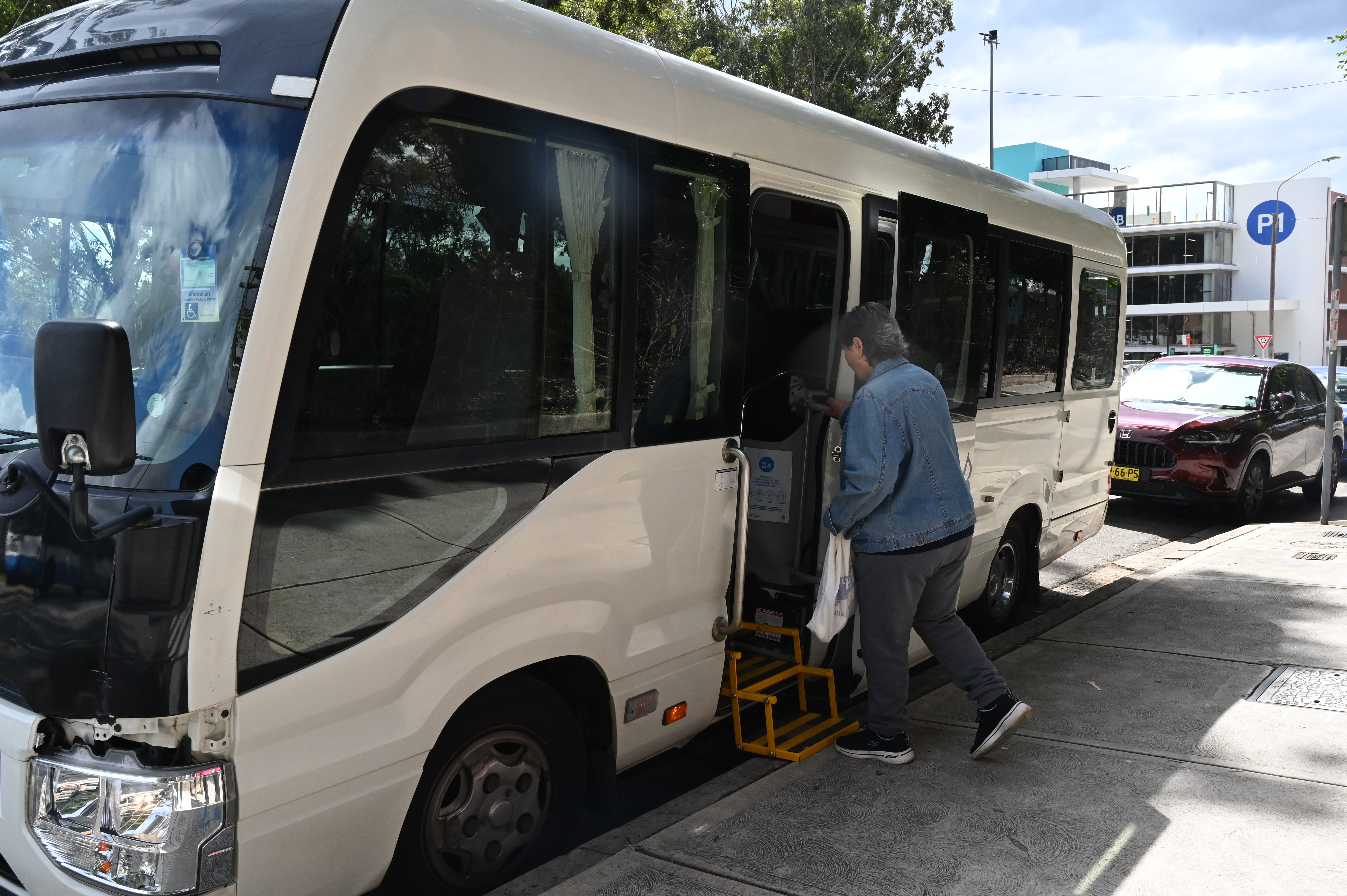 Bay Connection Bus Trip picking someone up.