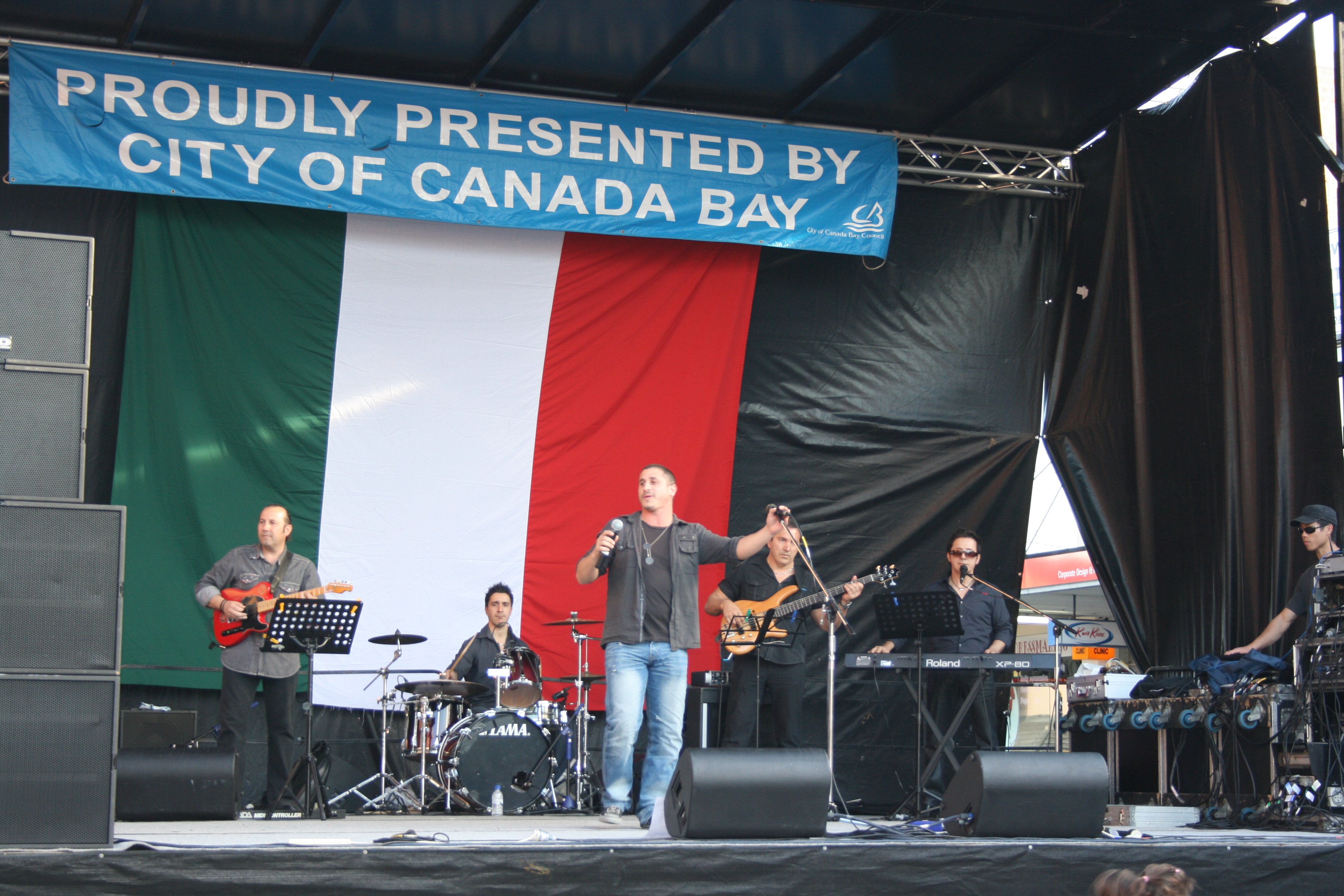 man singing on stage