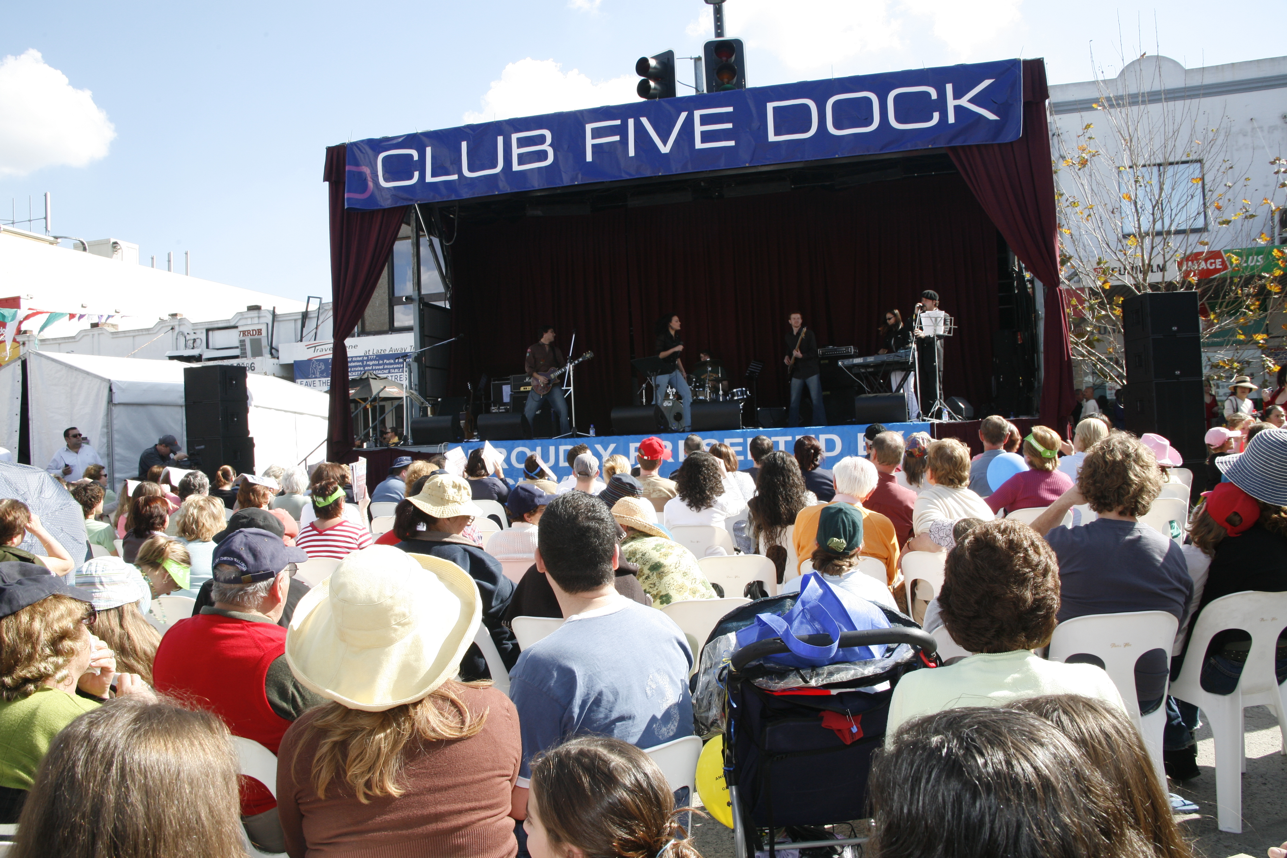 zoom out view of crowd seating in front of stage