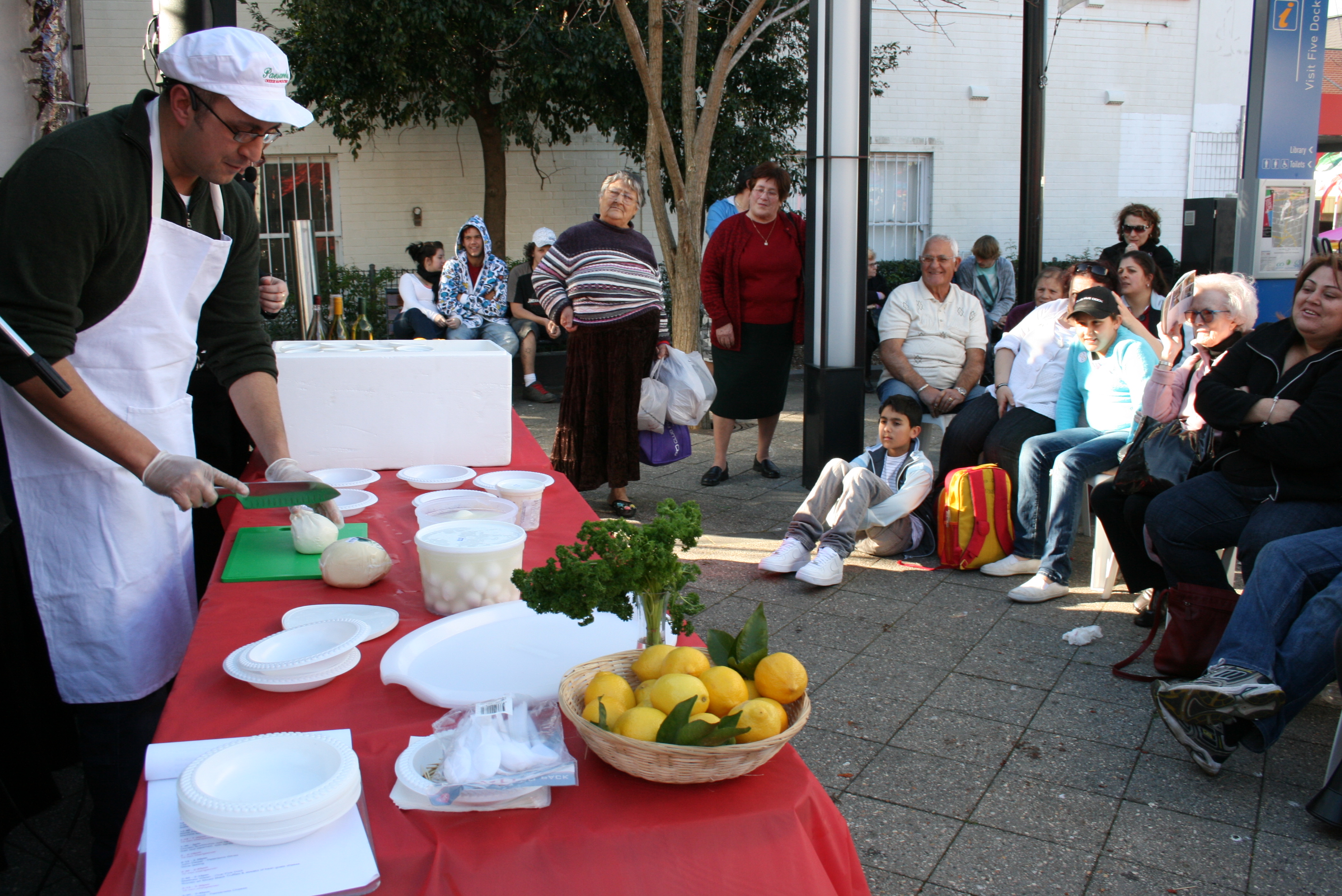 guy cooking food in front of audience