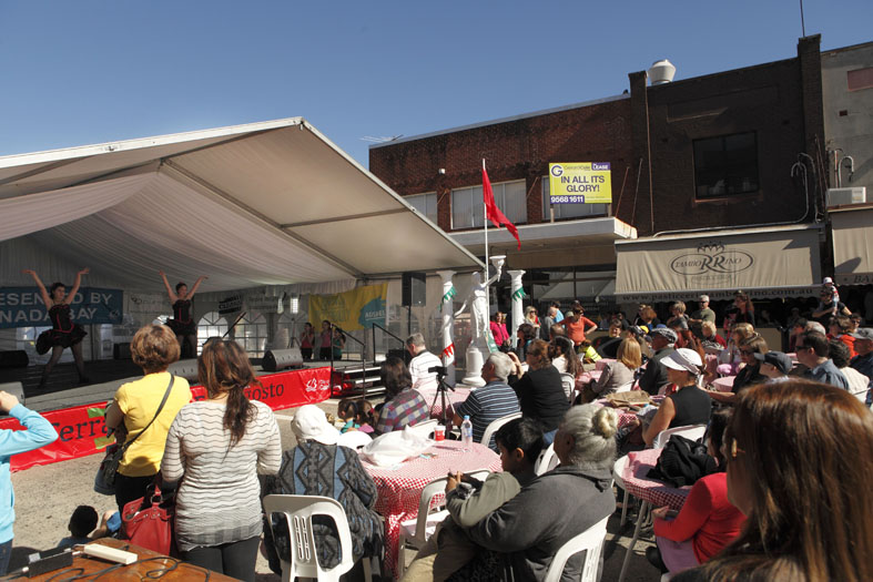 people seating down watching the stage