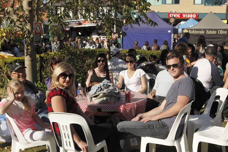 people seating at table smiling