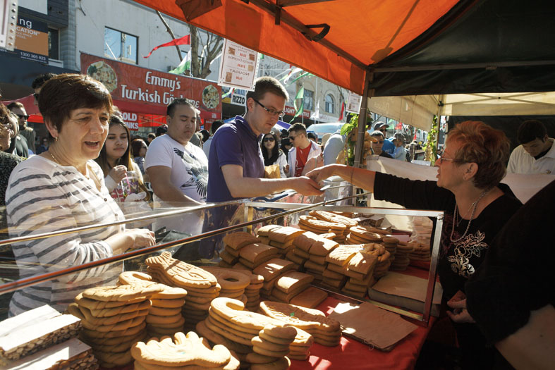 people ordering bread at a stall