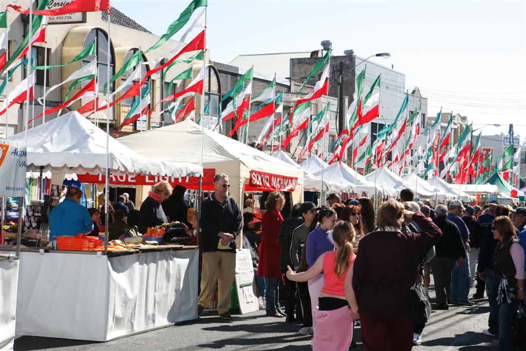 people lining up at stalls
