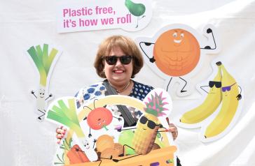 Image of resident with plastic free, it's how we roll poster
