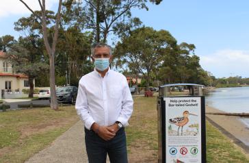 Mayor Angelo Tsirekas with the new artwork on the bin at Hen and Chicken Bay