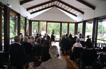 Jess Hill speaking to the audience at Cabarita Conservatory