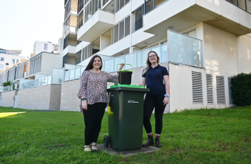 Deputy Mayor Stephanie Di Pasqua with Sustainability and Waste staff member outside Rhodes apartments