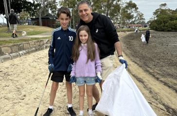 Family volunteering for Spring Clean Up at Halliday Park