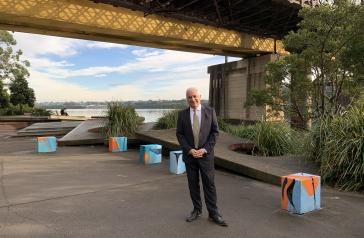 City of Canada Bay Mayor Michael  Megna under John Whitton Bridge, Rhodes alongside elements of the Confluence artwork by David Cragg.
