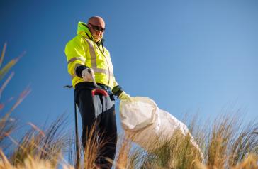 Council staff collecting rubbish.