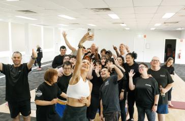 Group of people taking a selfie after an all-abilities exercise class.